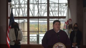 Illinois Gov. JB Pritzker, center, announces the reopening of the Murray Baker Bridge after seven months of rehabilitation at the Gateway Building, Oct. 26, 2020.