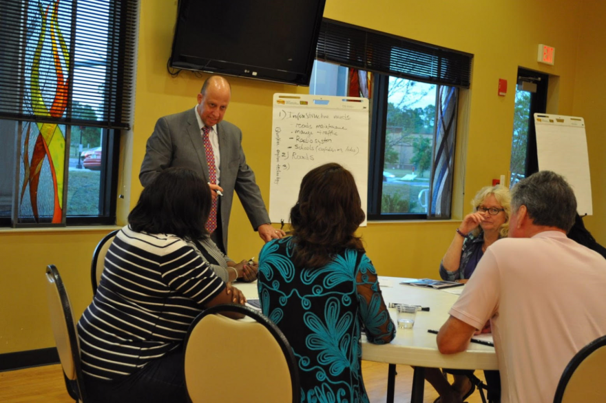 Attendees of the Gainesville Area Chamber of Commerce's Putting Children First Infrastructure Investment Initiative meeting on Wednesday engage in breakout sessions to discuss what they think are the most important infrastructure needs are. The meeting turned its focus on the outdated first-responder radio system in the county, which officials say hinders communication among police, firefighters and other responders. (Ashleigh Braun/WUFT News)