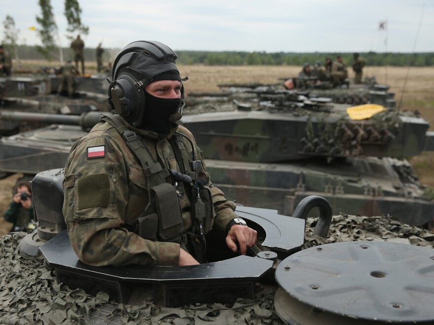 Soldiers of the Polish Army man their Leopard 2 tanks during the NATO Noble Jump military exercises of the VJTF forces on June 18, 2015 in Zagan, Poland.