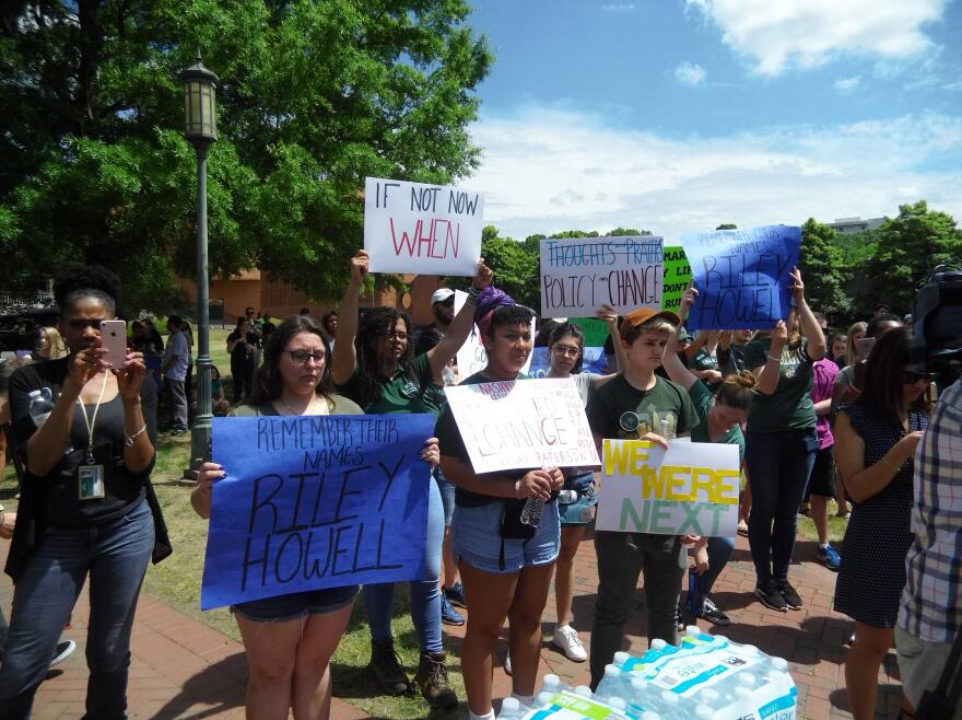 Other signs remembered those who died in the shooting. 