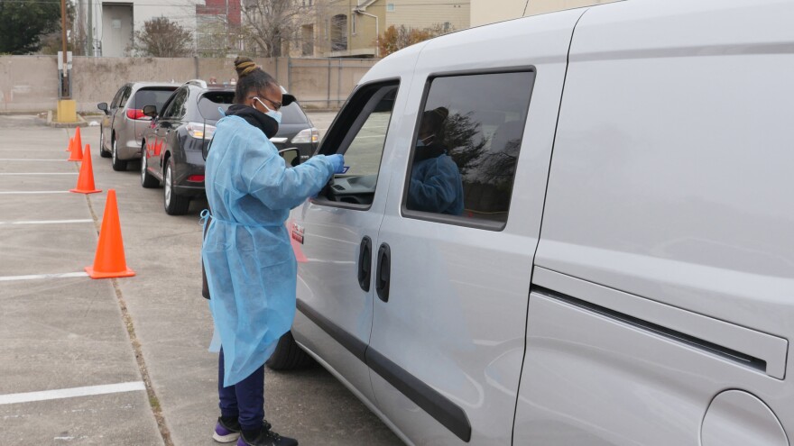 People arrive at a COVID-19 testing station in Houston, Texas, on Jan. 7. Texans were rushing to get tested as the state experienced an unprecedented spike in infections from the omicron variant.