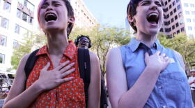 Katie Kuffel, right, debated whether to tell her story at a rally on Friday opposing violence against women. The rally stemmed from the May 23 shootings in Santa Barbara the week before. Kuffel's partner, Gerri DeSouza, joined her in a six-second scream.