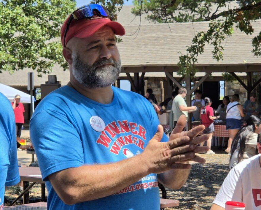 Stele James, a Democrat from western Yell County, showed support for Democratic secretary of state candidate Kelly Grappe and Libertarian gubernatorial candidate Colt Shelby at the Mount Nebo Chicken Fry on Aug. 29, 2026.