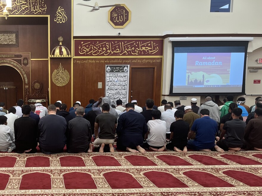 At the Islamic Center of Greater Miami, Muslims break their fast with a date and participate in the Maghrib, or sunset prayer of the day on March 11, 2025.