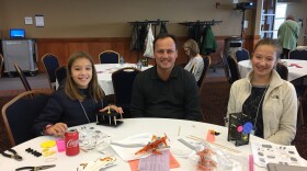 Jalyn (right) and Leah Botosan say their father, John, is the one who first got them interested in STEM, but events like the one at the University of Akron are great for getting hands-on experience.