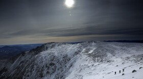 Under a midday winter solstice sun, a trio of climbers make their way up a slope on Mount Washington, Saturday, Dec. 21, 2019, in New Hampshire. (Robert F. Bukaty/AP)