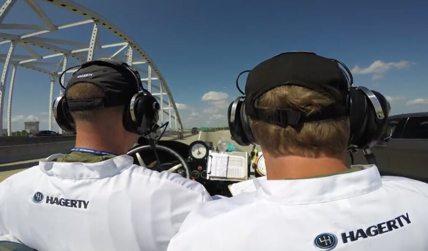 Driver and navigator run along Interstate 95 in Downtown Jacksonville in the Hagerty-owned 1917 Peerless Speedster minutes after the start of the 2017 Great Race on Main Street in Springfield. Their only navigation aids for the 2,300-mile journey: a classic clock and route notes on the car's dashboard.