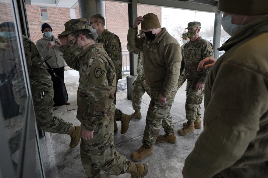 Members of the Maine National Guard arrive for duty at the Central Maine Medical Center, Thursday, Jan. 20, 2022, in Lewiston, Maine.