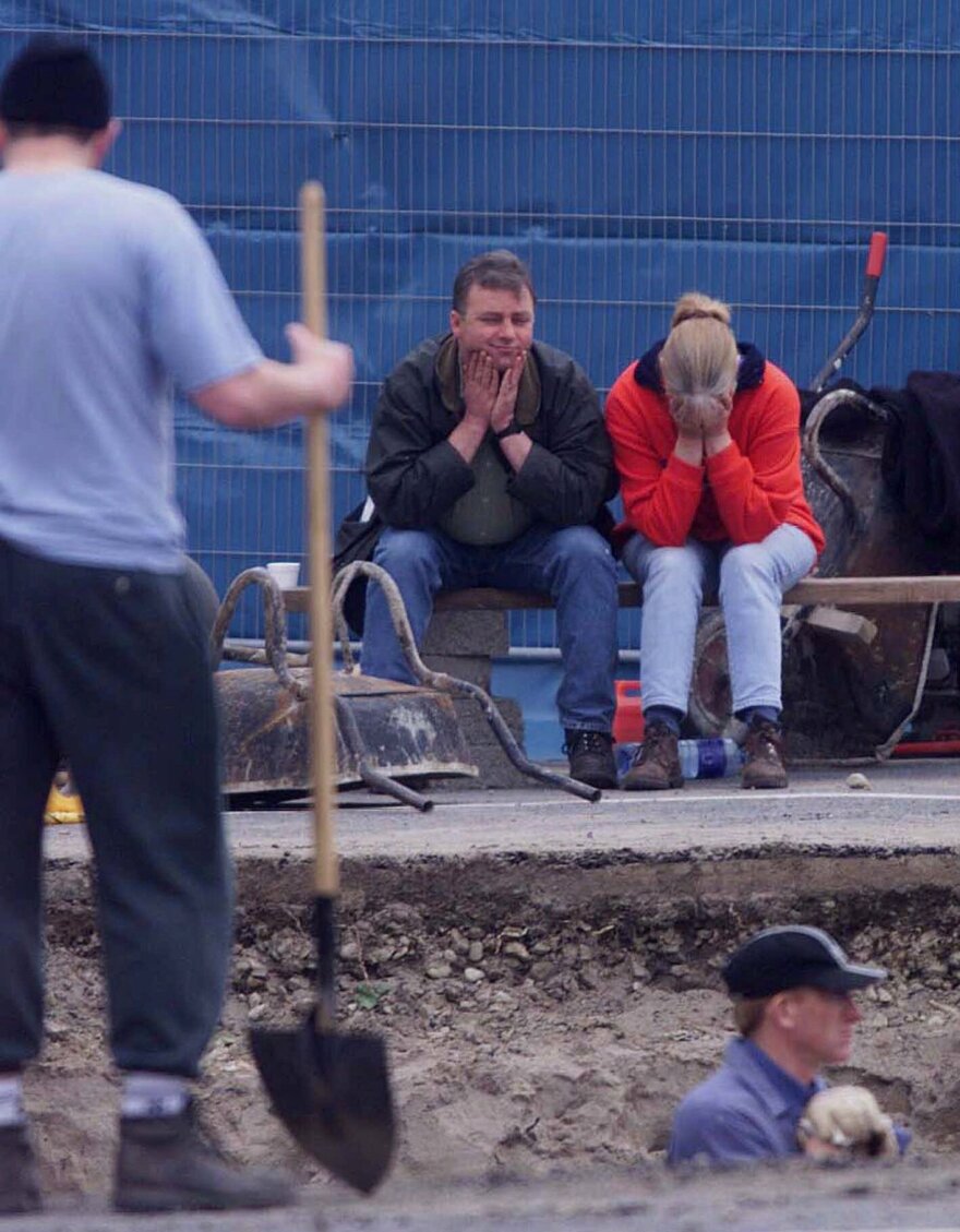 Jean McConville's daughter Helen McHendry waits with her husband Seamus as Irish police search for her mother's remains in 1999.