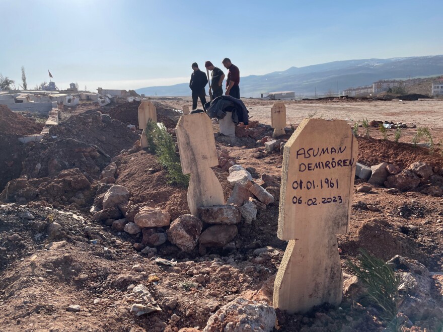 A wooden plank marks a grave in a cemetery in Pazarcik, Turkey.