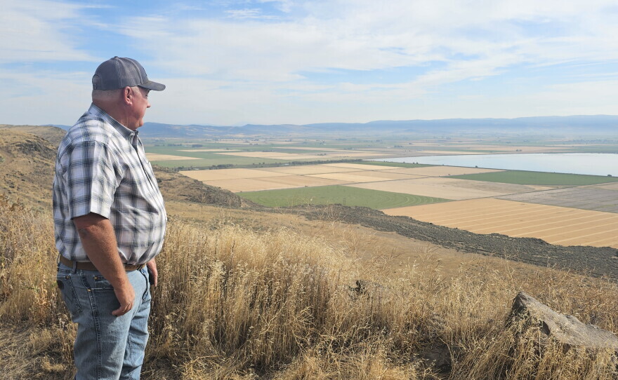 Scott Seus, president of the Klamath Water Users Association, looks over the Tule Lake National Wildlife Refuge from Sheepy Ridge on Aug. 20, 2026. Seus supports a proposal to circulate water through agricultural lands and refuge wetlands before returning it to the Klamath River.