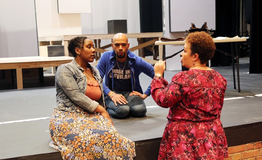 Actors Maya Nicholson and Carlos Antonio Cruz work with Nina Domingue, the playwright and co-director of "Red Summer," at Karamu House in Cleveland. 