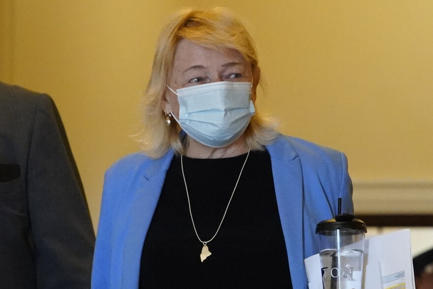 Gov. Janet Mills wears a face covering while walking through the halls of the State House, Wednesday, June 2, 2021, in Augusta, Maine.