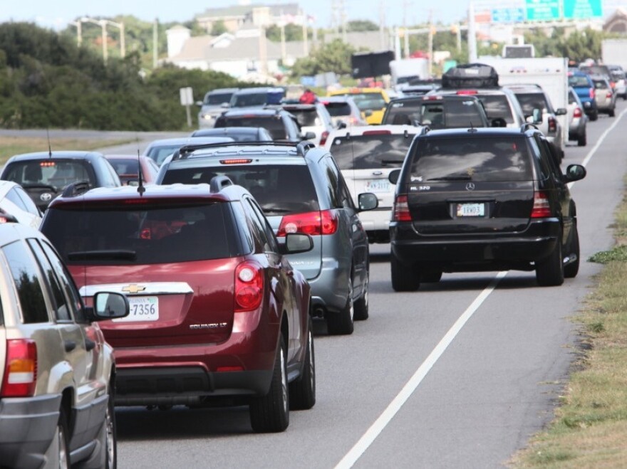 Cars evacuating Kitty Hawk, N.C., clog the roadway.