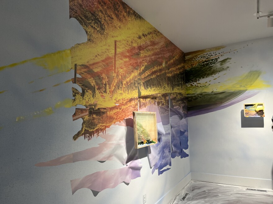 A corner of Hoffman's exhibit blending with paint on the wall.