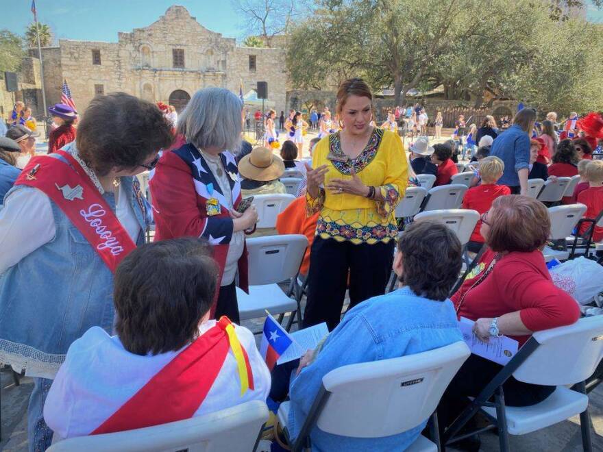 Sandragrace Martinez talks to voters in front of The Alamo in San Antonio.