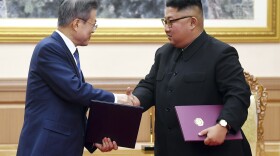 South Korean President Moon Jae-in (left) and North Korean leader Kim Jong Un shake hands after signing a joint declaration at the Paekhwawon State Guesthouse in Pyongyang, North Korea, on Wednesday.