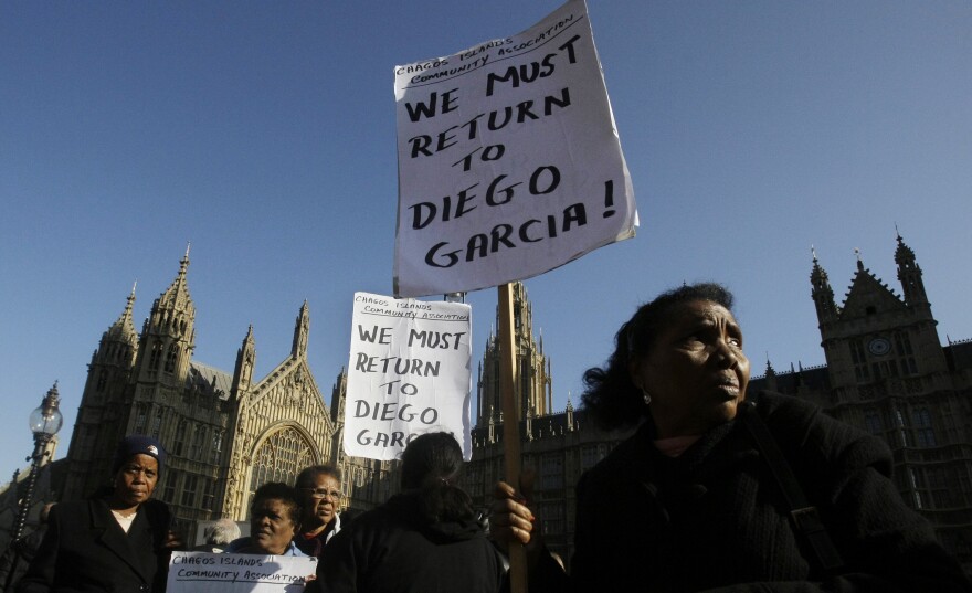 Women take part in a protest outside the Houses of Parliament in London in October 2008.