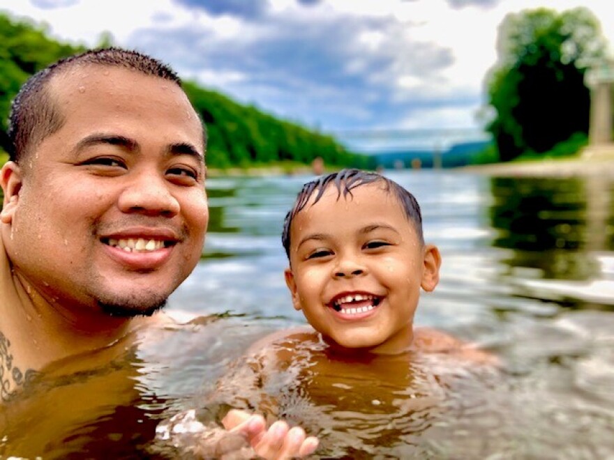 Vezna Hang and his son, swimming with their heads just above water