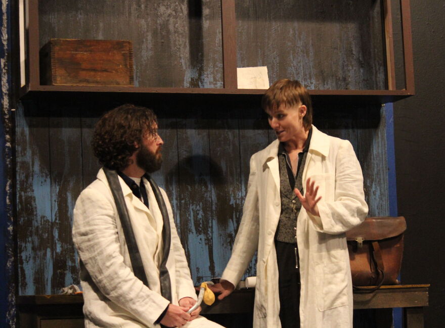 Elijah Gray (Amber McNew) talks telephone with his assistant Cornelius (Ben Williamson) during 'Ahoy-Hoy' rehearsal.