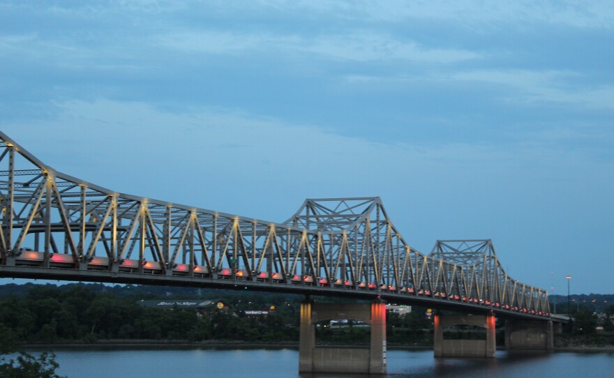 The Murray Baker Bridge over the Illinois River is lit in the colors of the German flag Thursday evening in honor of Peoria's 50th anniversary celebration with its sister city, Friedrichshafen, Germany.