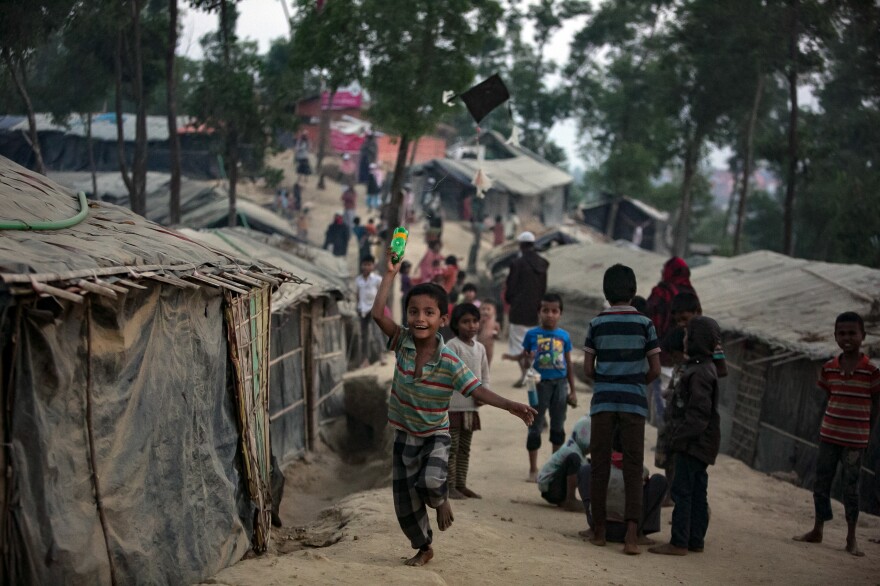 Mohammad Arfat flies a kite through the middle of the camp. The 7-year-old says any day he can't fly a kite he feels upset.