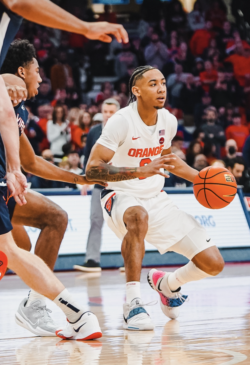 Syracuse guard Judah Mintz attempts to work around No.6 Virginia’s defense Monday night. The freshman had 20 points on 8-13 shooting.