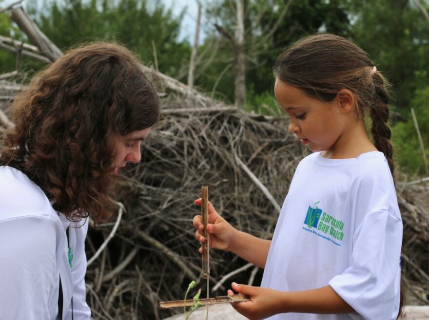 Sophia with 8-year-old birder Emmie Slusky. Sophie volunteers with numerous organizations, helping introduce a love of nature to young people.