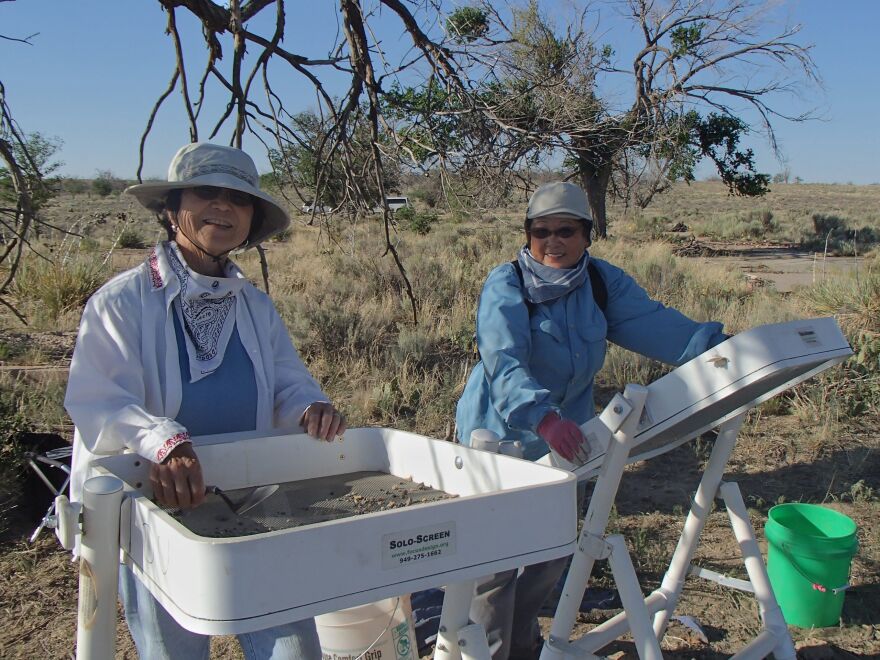 Carlene Tinker with another Amache survivor working on excavating the site to help find lost pieces of their history. They serve as volunteers for the work done by Bonnie Clark at Denver University.