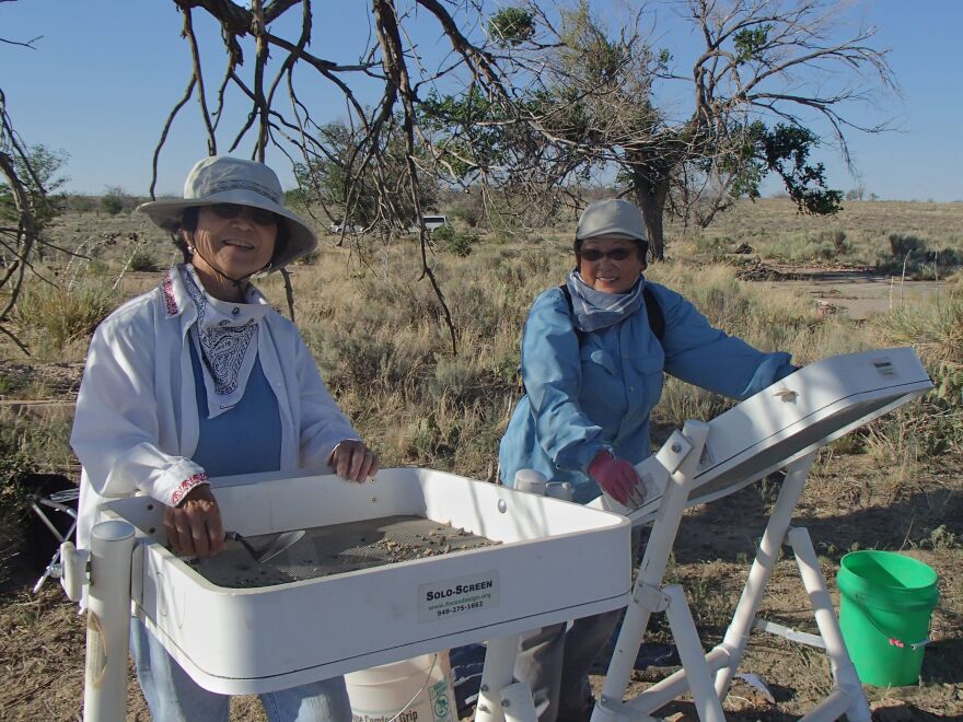 Carlene Tinker with another Amache survivor working on excavating the site to help find lost pieces of their history. They serve as volunteers for the work done by Bonnie Clark at Denver University. 