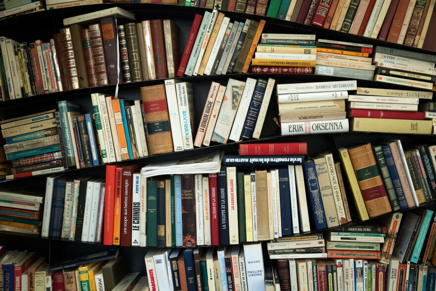 Here & Now's Jeremy Hobson speaks with Petra Mayer of NPR Books about what she suggests we read while we're contained in our homes. (Joe Saget/AFP via Getty Images)
