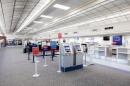 The check-in desk at Natrona County Airport is empty save for a few employees behind their dests.