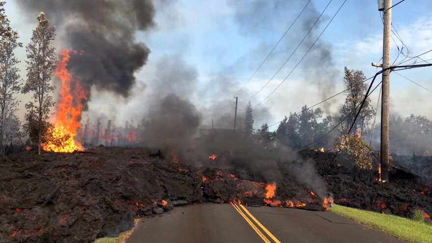 In this handout photo provided by the U.S. Geological Survey, lava from a fissure slowly rolls down the street on Saturday in the Leilani Estates subdivision near Pahoa, Hawaii after the eruption of the Kilauea volcano last week.