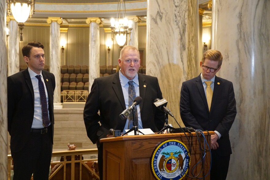 Senate President Pro Tem Dave Schatz, R-Sullivan, is joined by Majority Floor Leader Caleb Rowden, R-Columbia (right), and Minority Floor Leader John Rizzo, D-Independence (left), after the Senate passed legislation to create a statewide PDMP on Thursday.