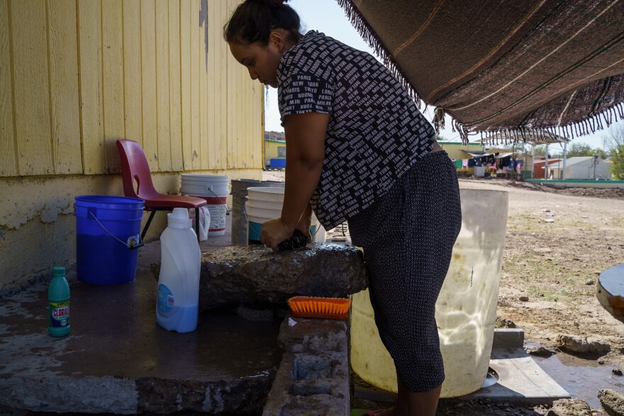 Carolina washes clothes at Pan de Vida Migrant Shelter in Ciudad Juárez on September, 6, 2020. 