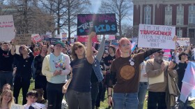 Protesters against bills targeting transgender youth in Missouri hold up signs during a rally held Wednesday, March 29, 2023. Hundreds of people gathered at the Missouri Capitol to show support to transgender kids in the state. 