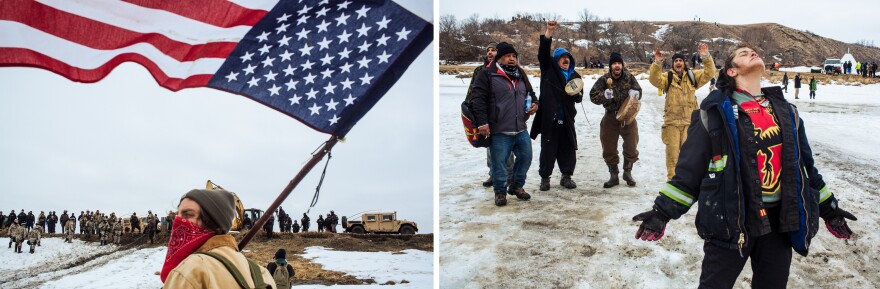Protestors stand on the Cannonball River as police secure the northern bank after they cleared the Oceti Sakowin camp.