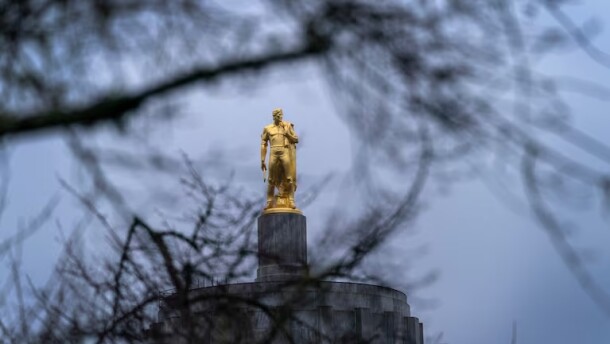 Golden statue on top of Oregon’s Capitol building in Salem.