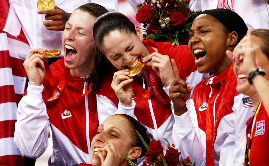 Katie Smith, Sue Bird, Diana Taurasi and Kara Lawson celebrate after winning the gold medal against Australia during the women's basketball gold medal game at the Beijing Olympic Basketball Gymnasium on Day 15 of the Beijing 2008 Olympic Games on August 23, 2008 in Beijing, China.