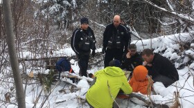 The Wildlife-Human Attack Response Team at the site of a grizzly bear attack north of Columbia Falls, MT.