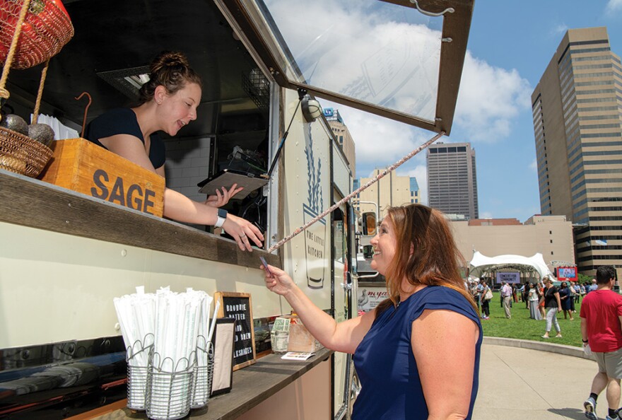 A food truck serves lunch at the Columbus Commons Food Truck Food Court in downtown Columbus in 2019.