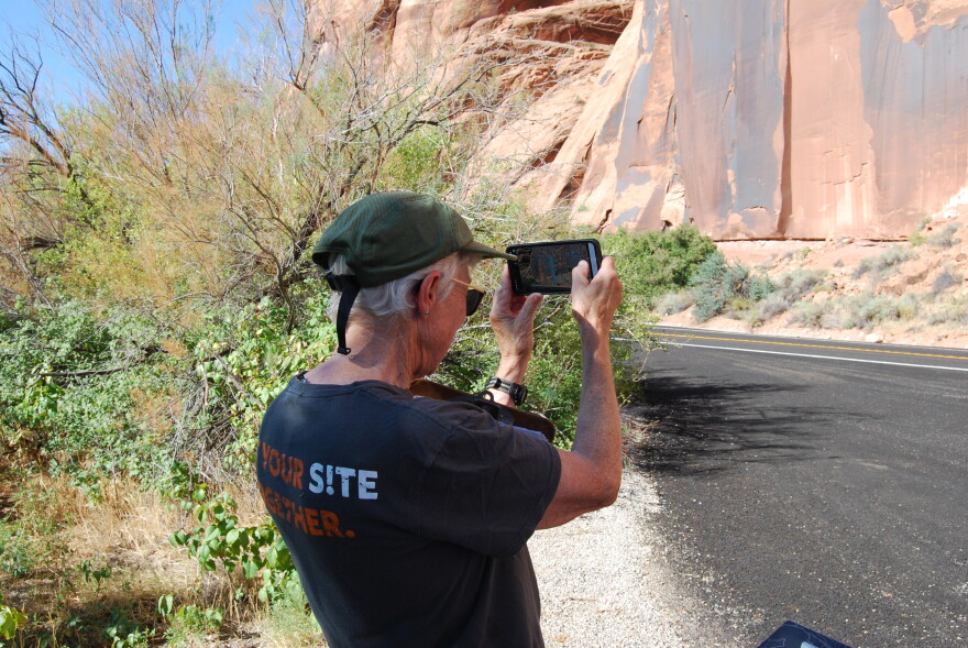 Smith uses her app to photograph petroglyphs to put together a report.