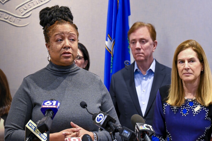 Midwife Lucinda Canty, backed by Gov. Ned Lamont and Lt. Gov. Susan Bysiewicz, speaks at a press conference on proposed new legislation to expand Connecticut’s maternal healthcare access and affordability