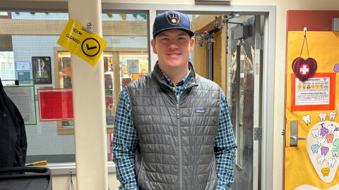 Eagle’s View Elementary School Principal Riley Spetz, a lifelong Milwaukee Brewers fan, wears a Brewers cap.