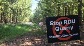 Signs opposing the proposed rock quarry on airport land have popped up around Wake and Durham counties.
