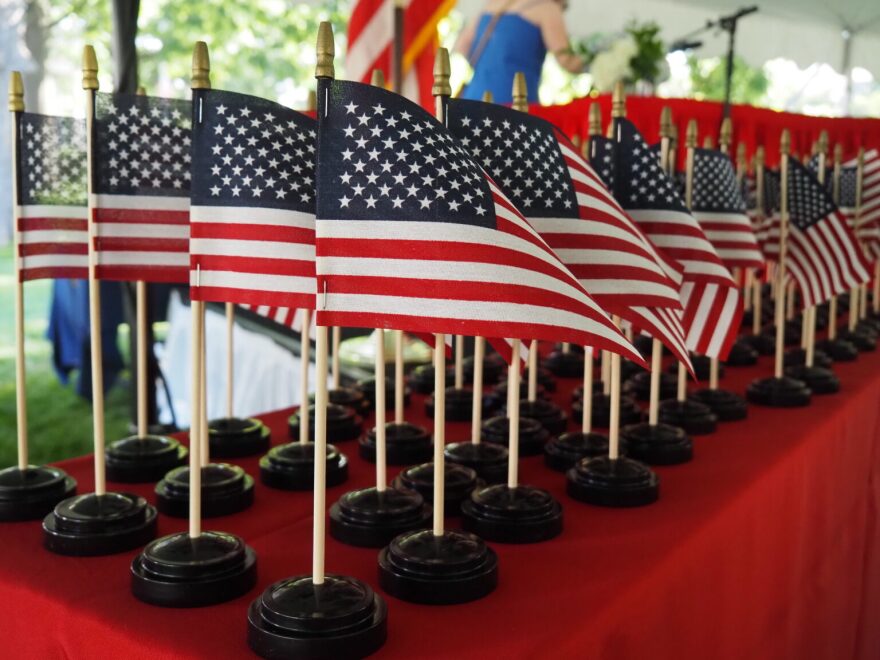 Miniature American flags sit on a table before being presented to new citizens on Thursday, July 2, 2026.