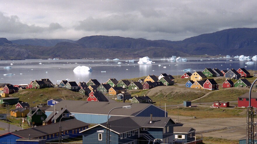 Giant icebergs float in the fjord in the southern Greenland town of Narsaq, the site of a controversial Australian-led uranium and rare-earth mining project. The open-pit mine has divided opinion on the island, which goes to the polls on Tuesday.