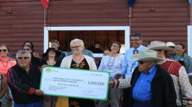 The Blackfeet Nation accepts a $1 million grant from the Foundation for Food and Agricultural Research Friday during North American Indian Days in Browning. 