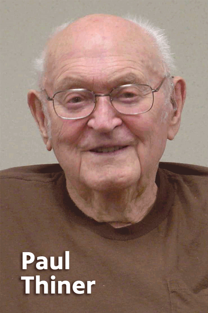 Elderly Paul Thiner wearing glasses and a brown shirt