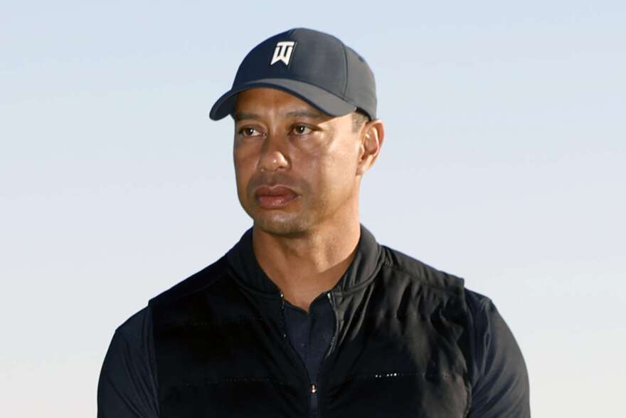 FILE - In this Feb. 21, 2021, file photo, Tiger Woods looks on during the trophy ceremony on the practice green after the final round of the Genesis Invitational golf tournament at Riviera Country Club, in the Pacific Palisades area of Los Angeles. The Los Angeles County sheriff plans to announce Wednesday, April 7, 2021, what caused Woods to crash an SUV in Southern California earlier in the year, seriously injuring himself in the wreck. (AP Photo/Ryan Kang, File)